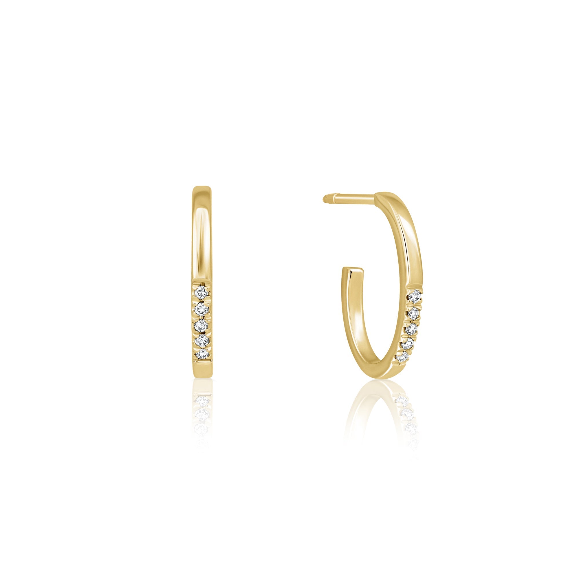 Oval shaped gold hoop earrings studded with diamonds