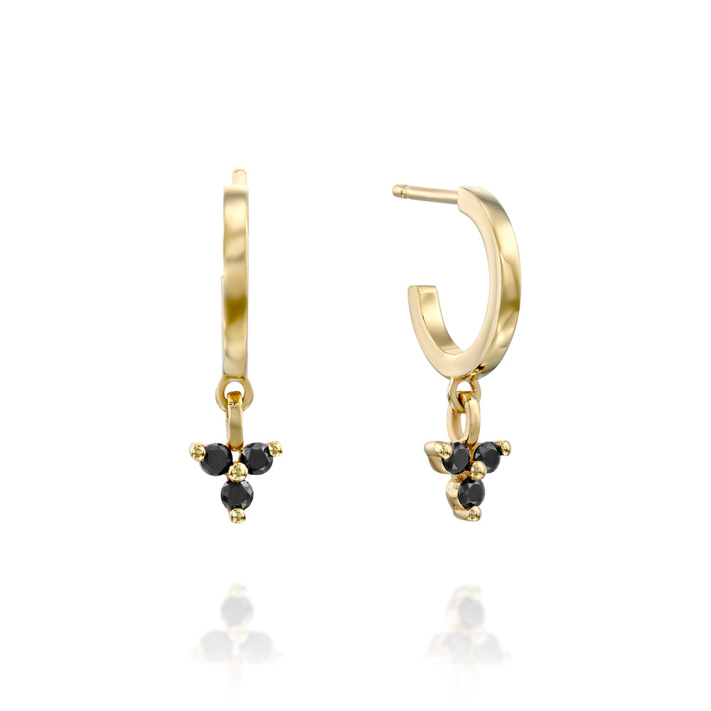 Gold hoop earrings with a pendant studded with 3 black diamonds