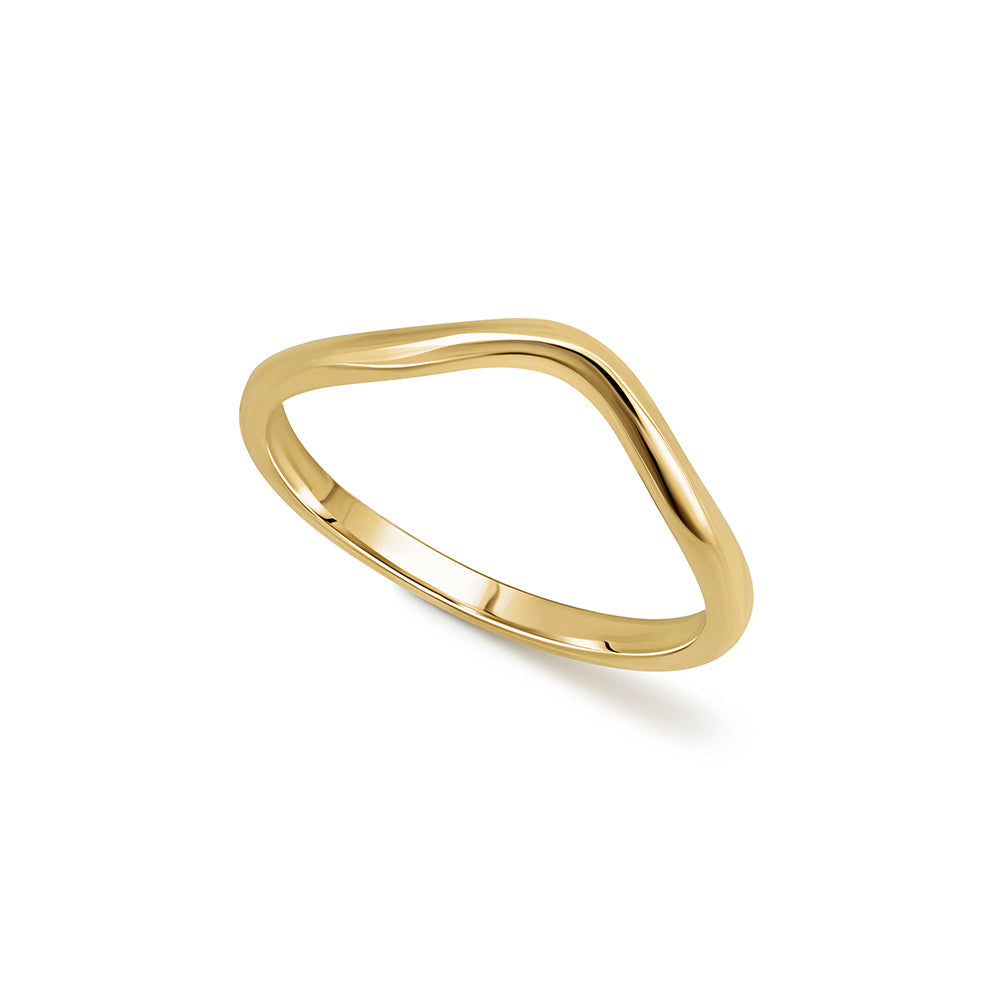 A gold wedding ring in the shape of a wave - a complementary ring