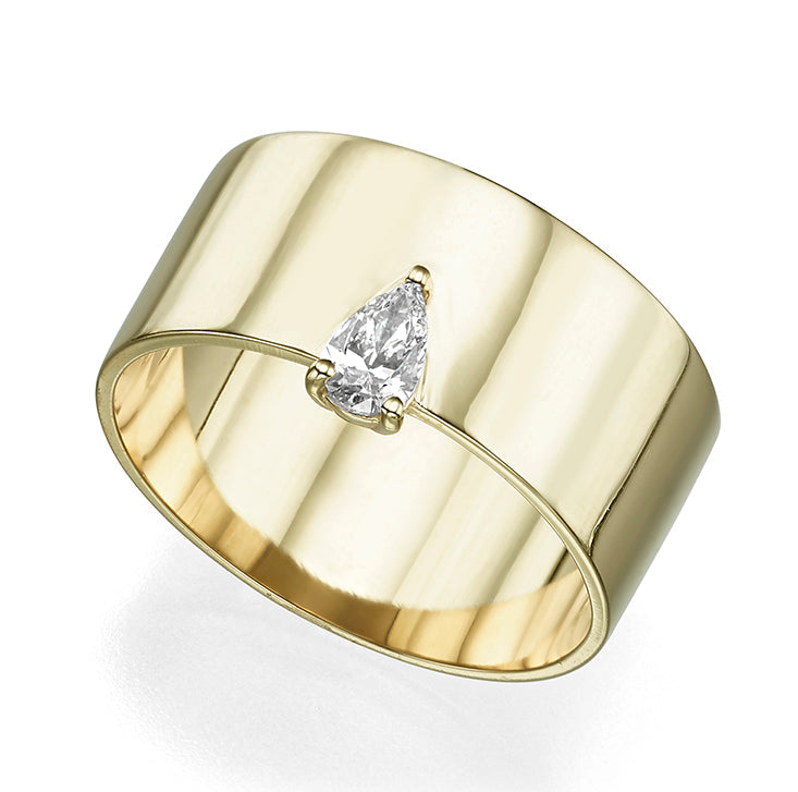 A wide gold ring set with a drop cut diamond