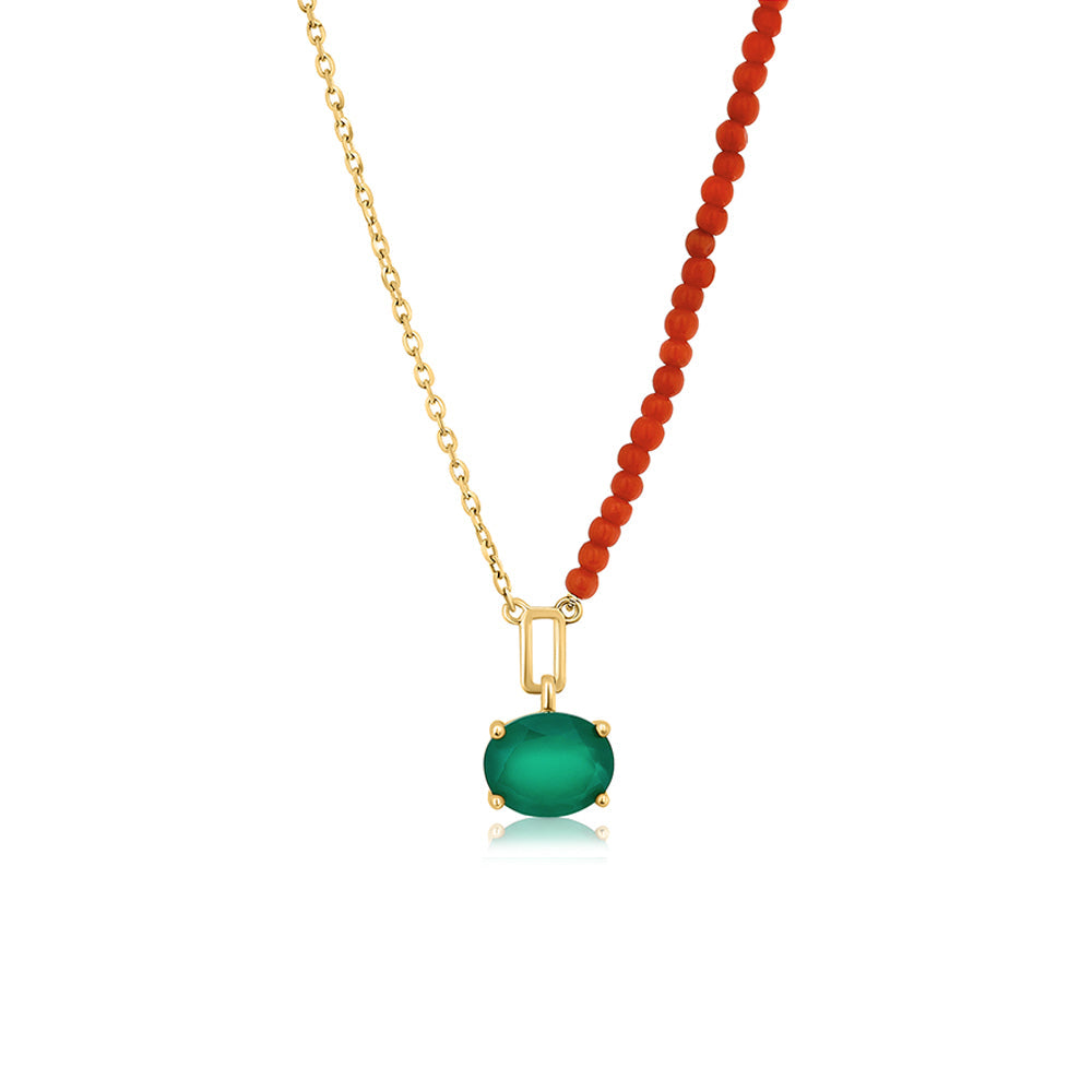 A gold chain combined with natural coral, in the center a green onyx pendant with an oval cut