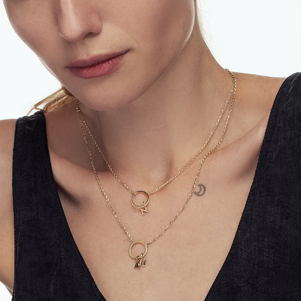 A special gold chain with letters. Name necklace for man and woman