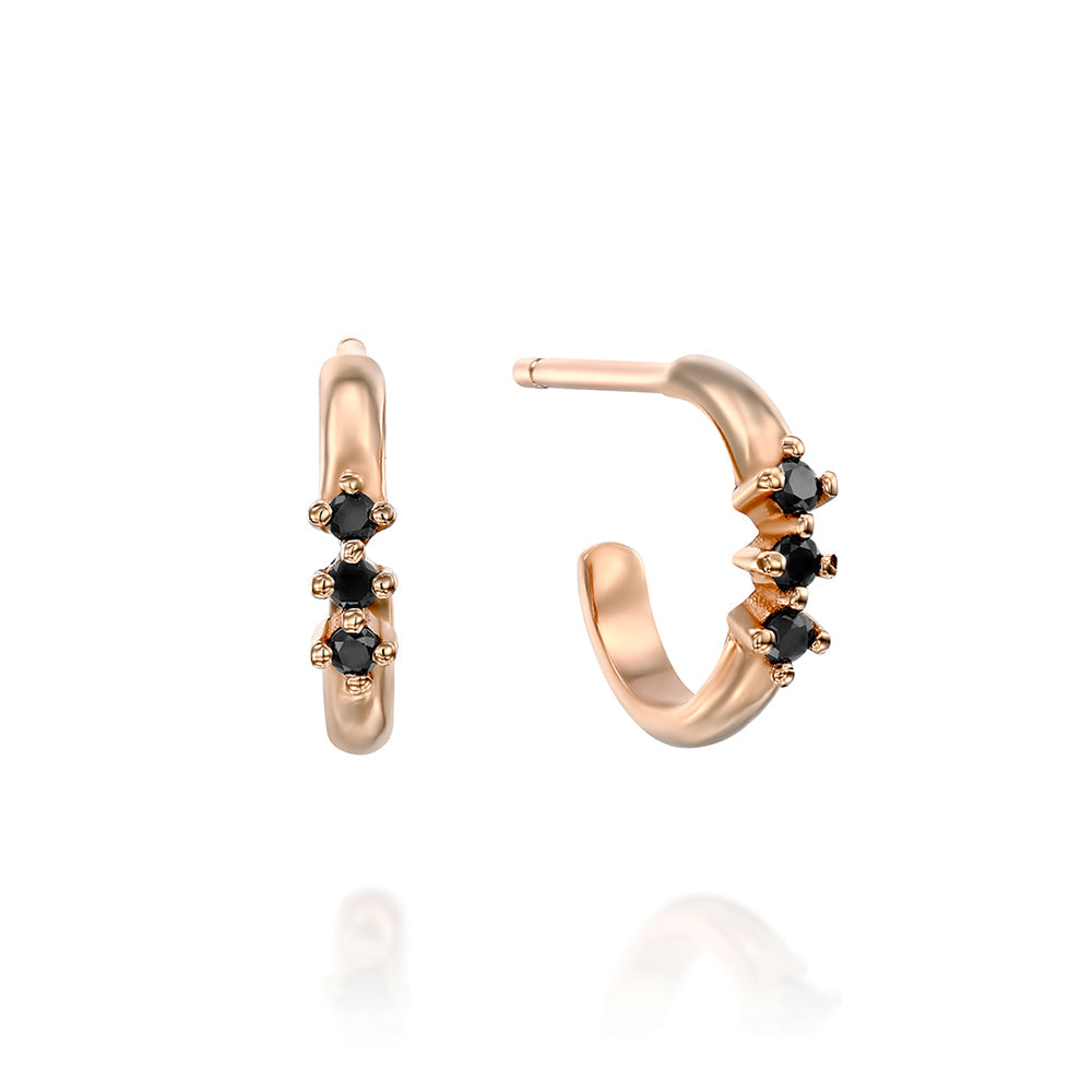 Small hoop earrings with a special setting of 3 black diamonds in each earring