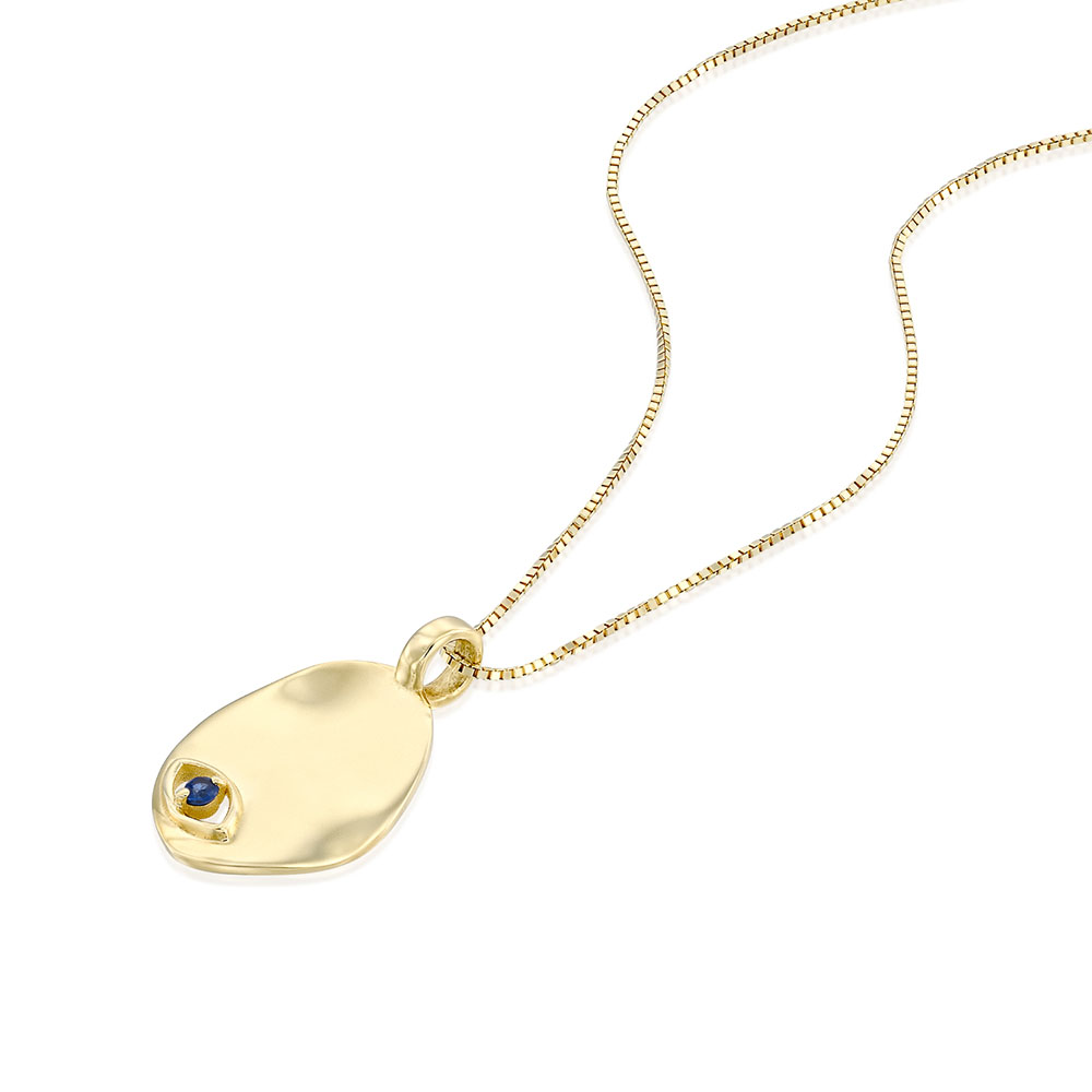 Gold necklace with an amorphous pendant with a sapphire inlaid eye decoration
