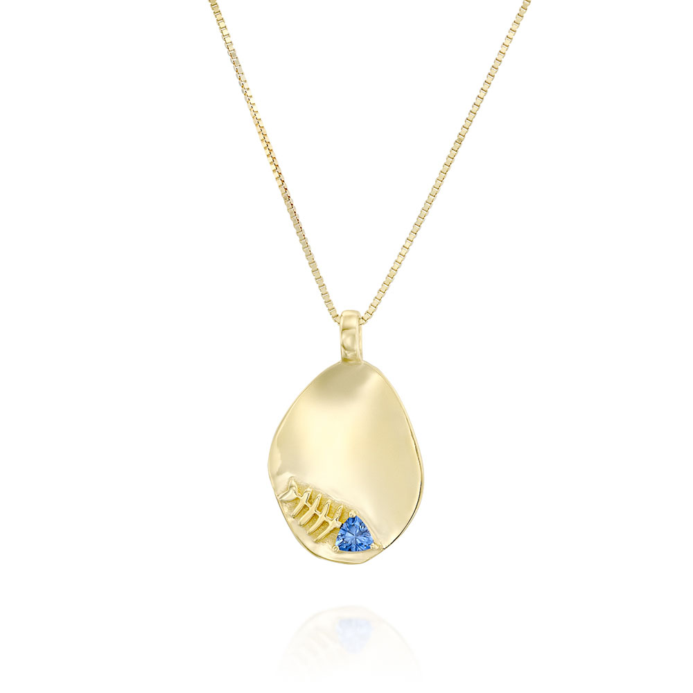 Gold necklace with an amorphous pendant decorated with a fish inlaid with a sapphire stone
